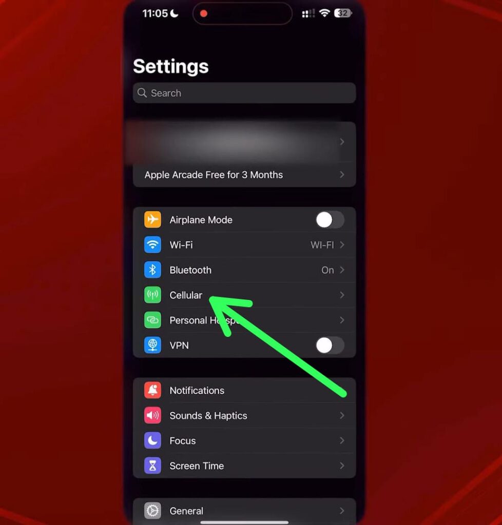 iPhone settings screen with a green arrow pointing to the Cellular option